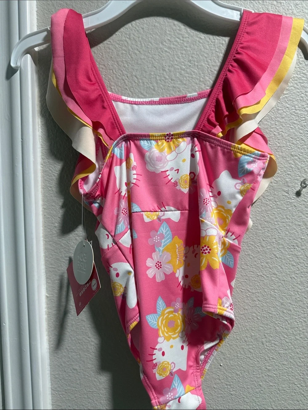 Hello Kitty Pink Floral Ruffle One-Piece Swimsuit with Yellow Trim.  New size 6